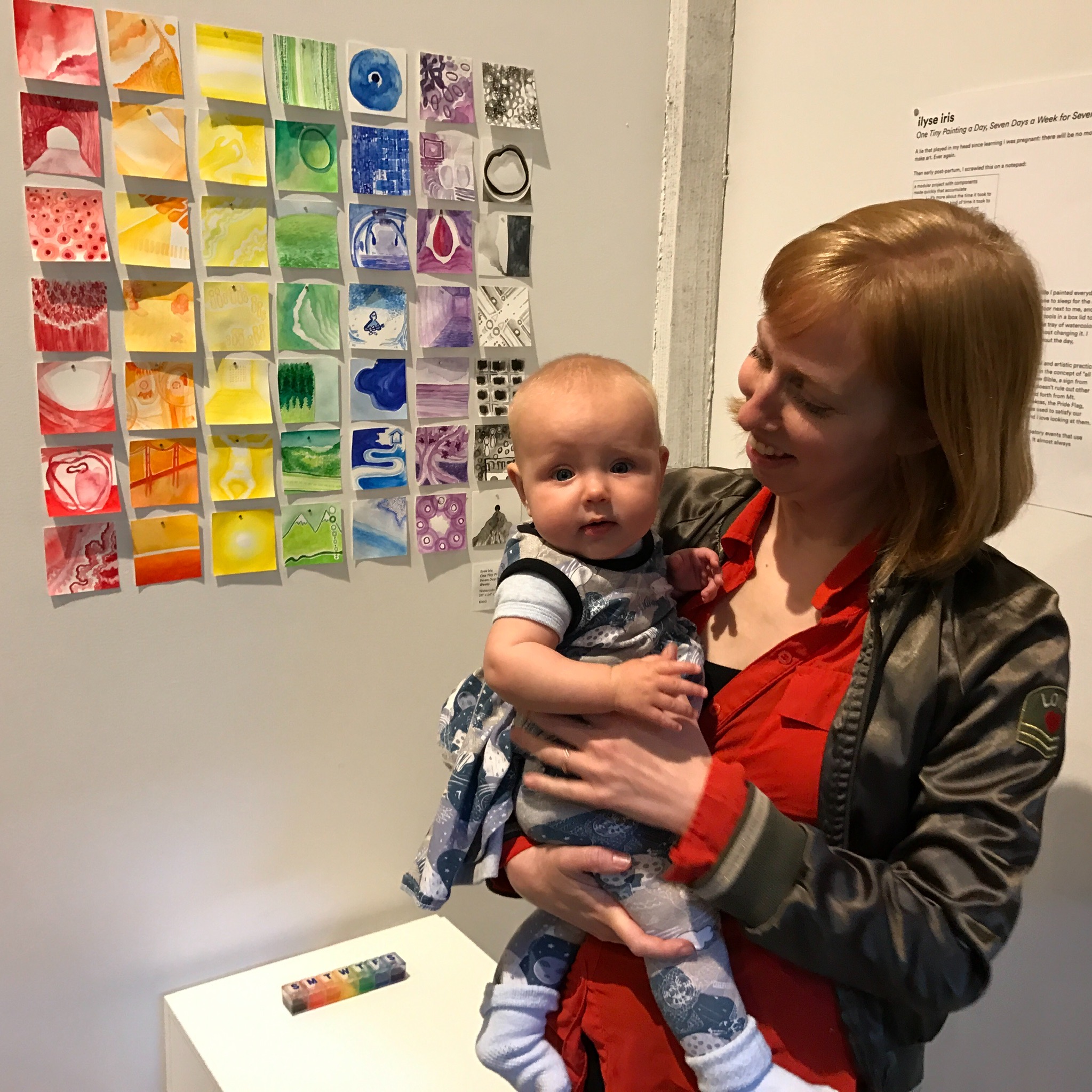 With baby D, watercolors in background